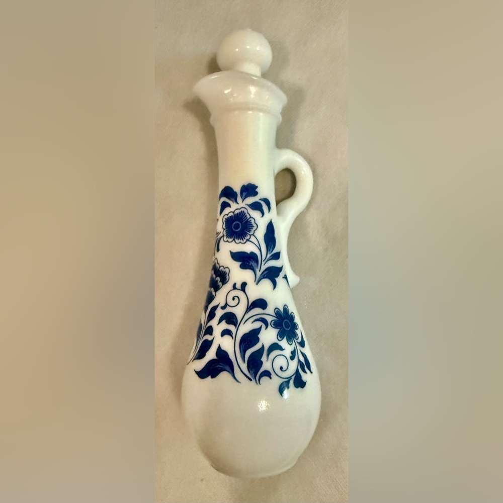 Vintage, Avon milk glass bottle. White with navy.